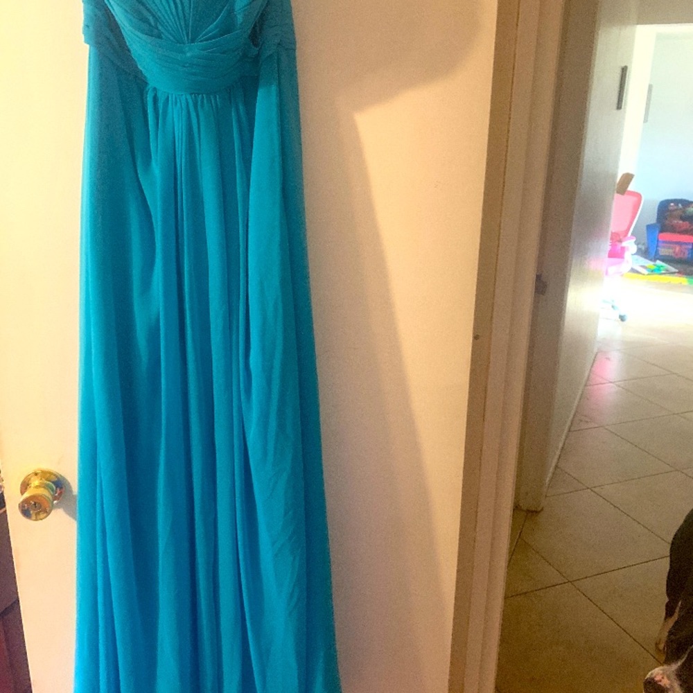 A dark teal bridesmaids dress